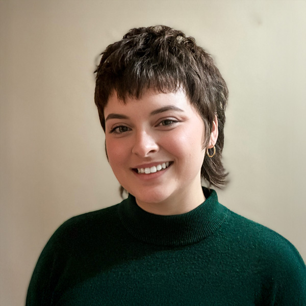 Jane Sorenson, Resident Services Director at Montvale Senior Living, smiling in a professional headshot, wearing a green sweater, with short textured hair and a neutral indoor background.