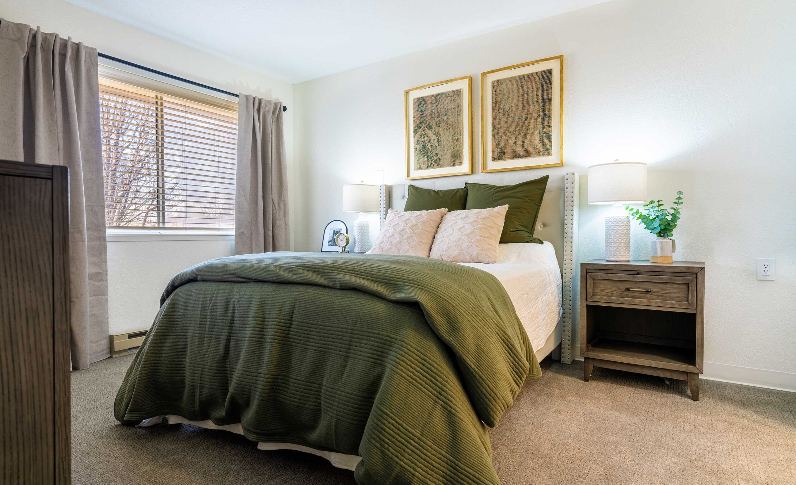 Newly renovated apartment bedroom at The Montvale Senior Living in Springfield, Illinois, completed in 2025, featuring warm and elegant decor.