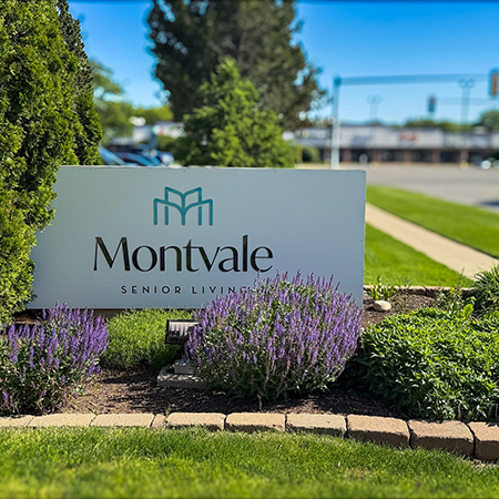 The exterior sign for The Montvale Senior Living, beautifully landscaped.